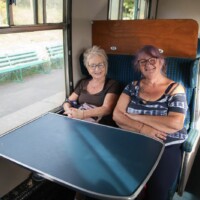 Helen and Gill sat together on the train.