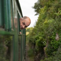 Kevin, a participant, leaning his head out of the train.