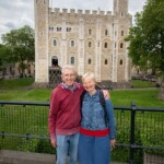 Two participants smiling at the camera with the 'White Tower' in the background.