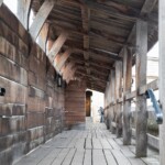 A photo showing an empty outside passageway in the Tower of London.