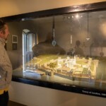 Participant looking at a scaled down version of the Tower of London as it was in 1381.