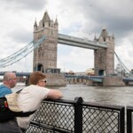 Two participants looking at the Thames, with Tower Bridge in the background.