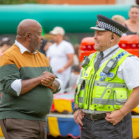 A police officer chatting with one of the helpers at the 2024 cultural fayre.